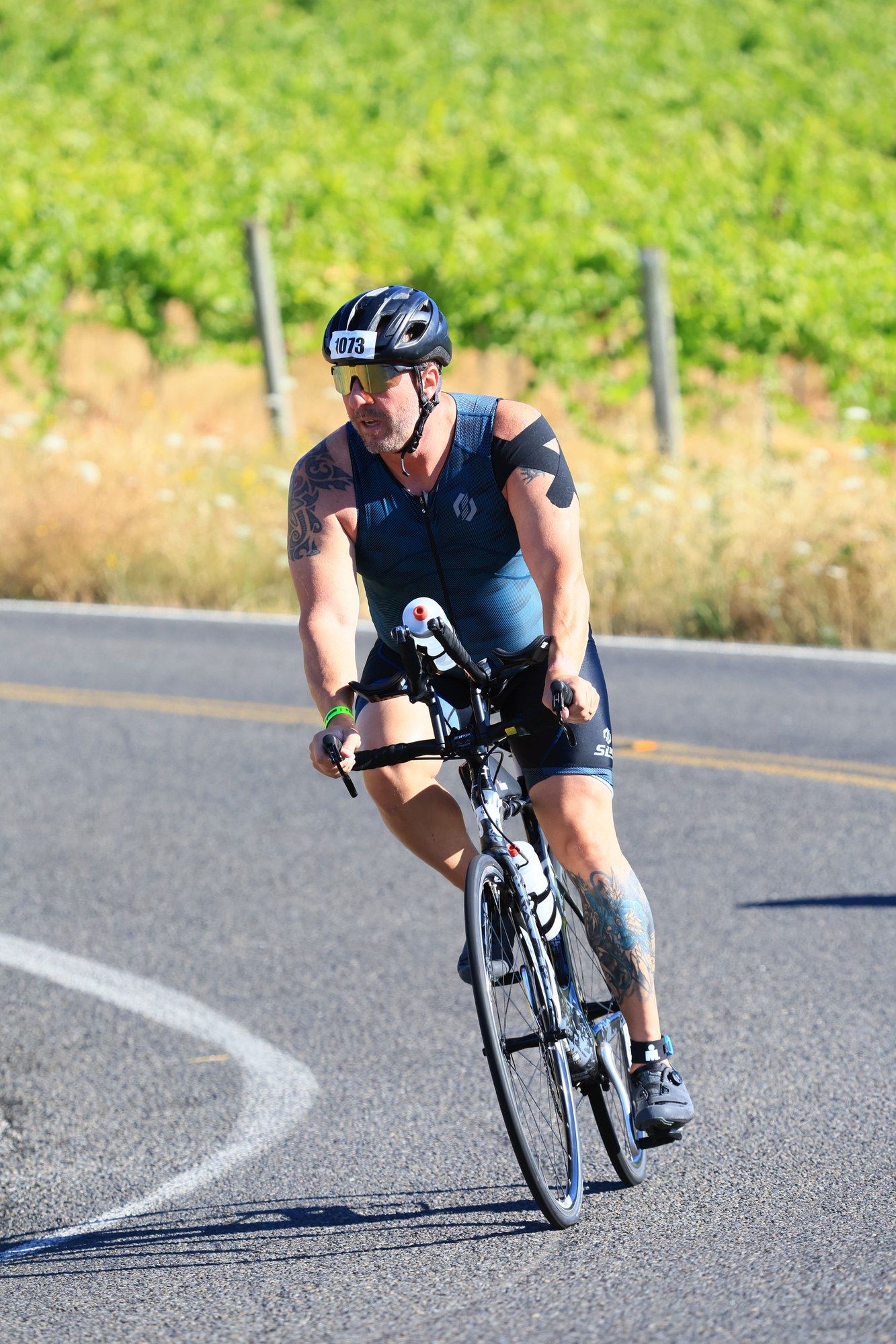 Ben Baxter leaning into a turn on the bike course at IRONMAN 70.3 Oregon